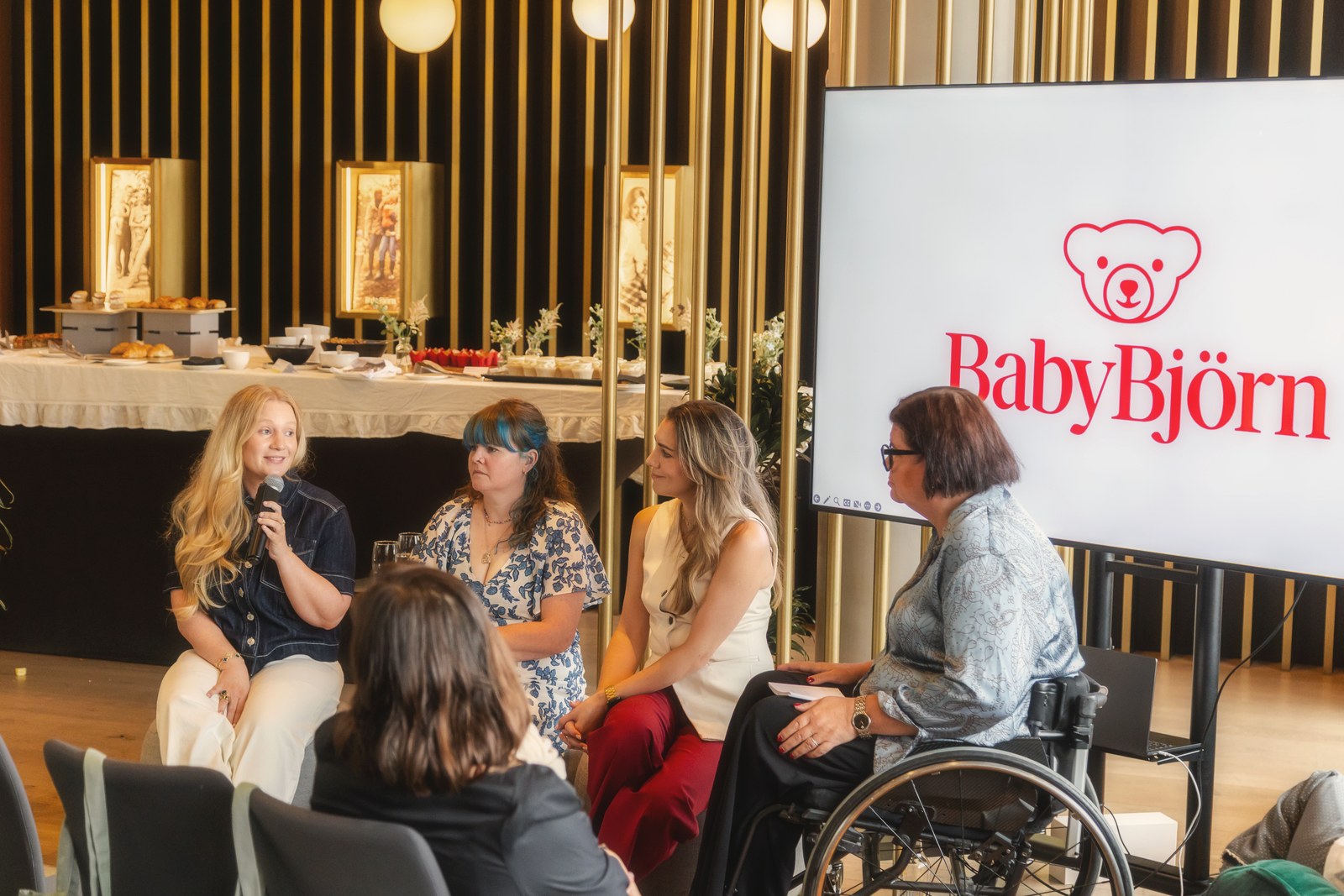 Millie speaking on the panel at the BabyBjörn launch in London
